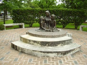 "Love's Embrace," a statue of Pam and her daughters in Spring Valley Village, Texas