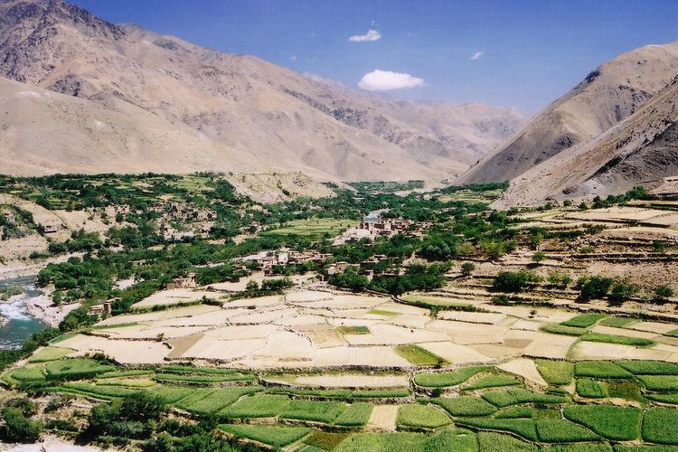 Panjshir Valley in Northeastern Afghanistan surrounded by mountains and ricefields.