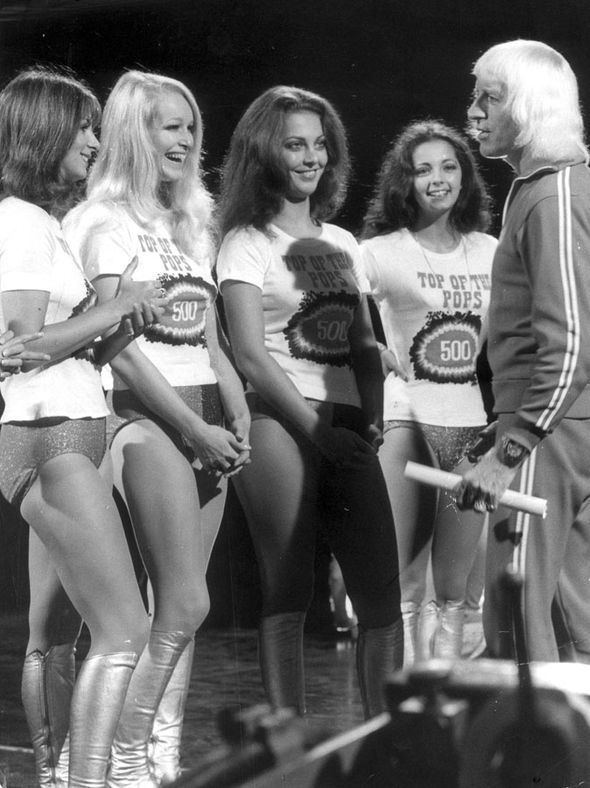 Four members of Pan's People meeting with Herman van Veen and wearing white shirts and very short shorts.