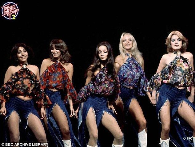 Five members of Pan's People dancing on stage and wearing jean shorts and floral dresses.