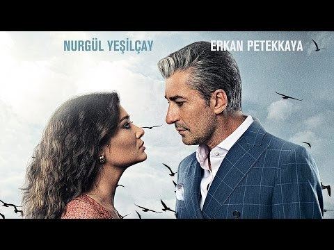 Poster of "Paramparça", a Turkish television drama series featuring Nurgül Yeşilçay and Erkan Petekkaya.