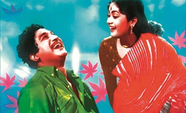 Sivaji Ganesan while laughing and wearing a green polo and Savithri wearing a red dress