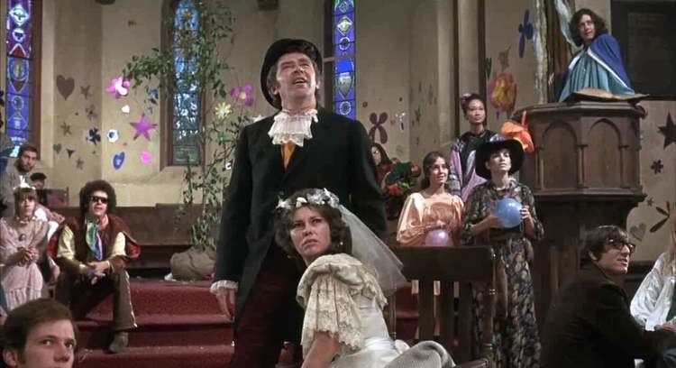 Pat Quinn (actress) and James Broderick during their wedding in a movie scene from Alice's Restaurant (1969)