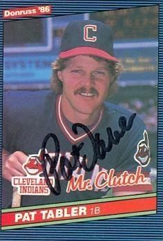 Pat Tabler smiling while wearing a blue and red cap and blue and red t-shirt