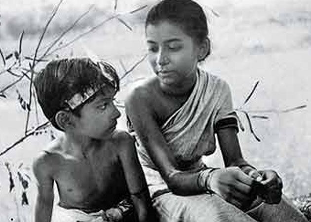 Pather Panchali movie scenes  with a Doodle depicting a famous scene of the young Durga and Apu running through fields from possibly his most famous film Pather Panchali 