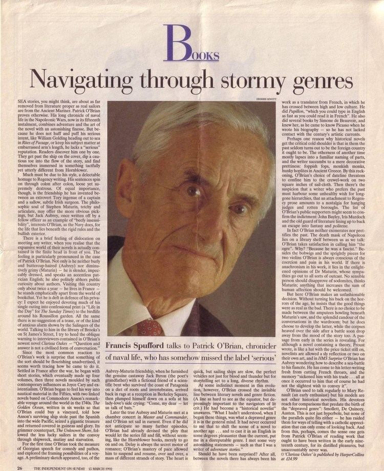 In a newspaper, at the top is a word “Books Navigating through stormy genres” in the middle, Patrick O'Brian is serious, has white hair black eyebrows, wearing white polo with red necktie under a black coat, below is a word “Francis Spufford talks to Patrick O’Brian, chronicler
of naval life who has somehow missed the label 'serious' along with the newspaper contents.