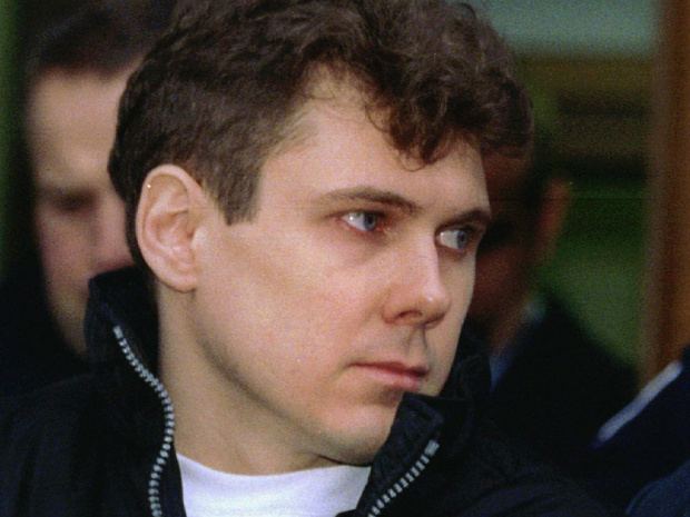 Paul Bernardo wearing a white shirt and a black jacket