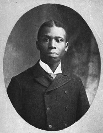 Portrait of Paul Laurence Dunbar looking at something with a serious face while wearing a long sleeve under a double-breasted coat