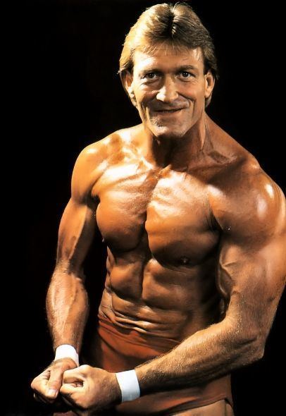 Paul Orndorff smiling while showing his muscle