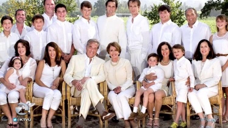 Children and grandchildren of Paul Francis Pelosi Sr. and Nancy Patricia Pelosi wearing all white.