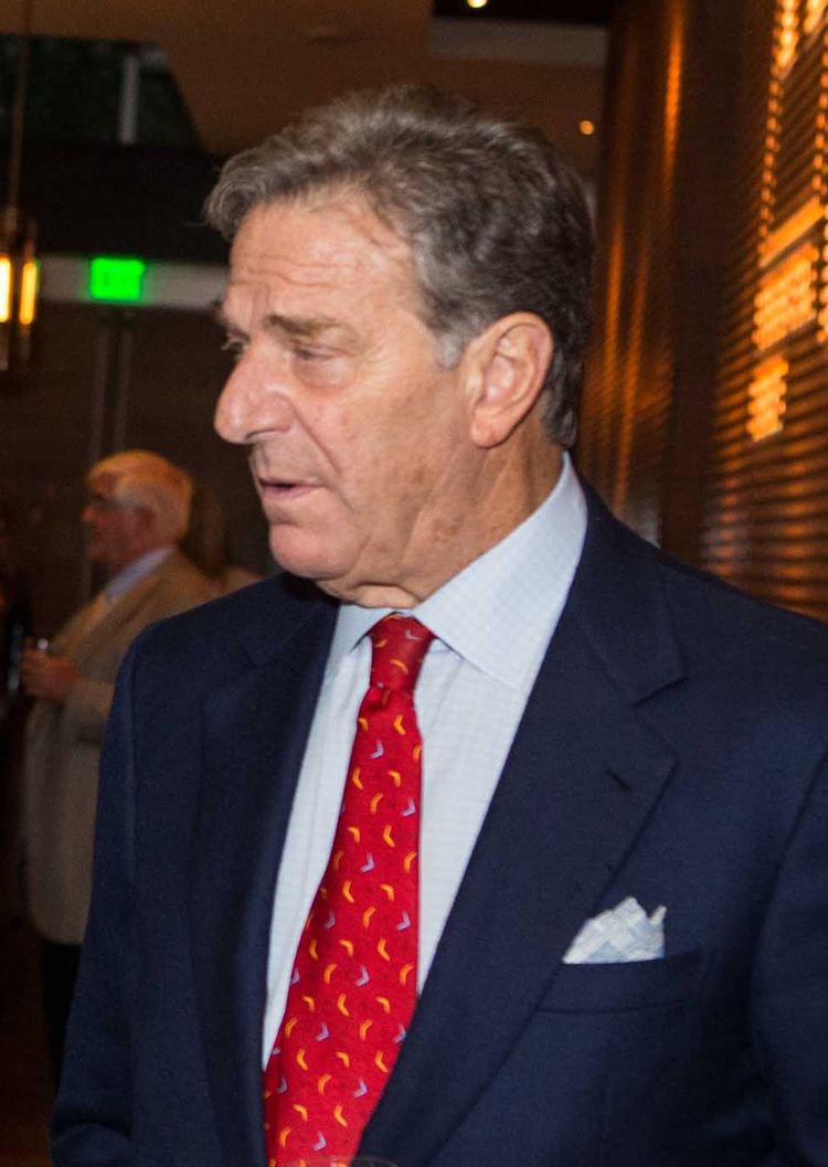 Paul Francis Pelosi Sr. wearing a blue suit and a red tie.