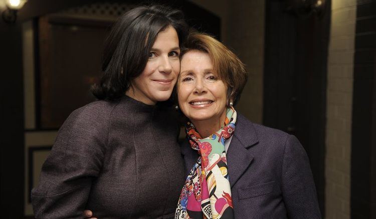 Nancy Pelosi with short hair, wearing a colorful scarf together with her daughter, Alexandra Pelosi wearing a black dress.