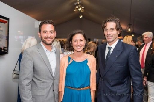 Paul Pelosi Jr. wearing a suit and a tie together with a girl wearing a blue dress and a man wearing a gray suit.