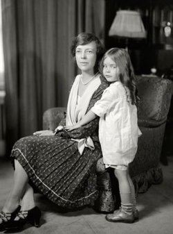 Paulina Longworth, at a young age with her mother Alice Roosevelt wearing a dress.