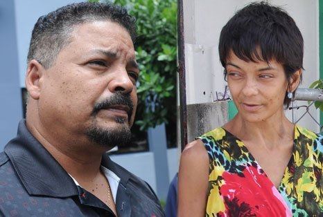 On the left, Pedro Rosa Nales with mustache and beard while wearing a black polo shirt. On the right, Lizbeth Rosa Ortiz wearing a colorful sleeveless blouse