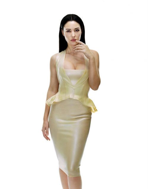 Monica Bellucci as Persephone posing while wearing a cream sleeveless dress