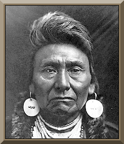 Peta Nocona in his fierce look wearing a pair of earrings and necklacess