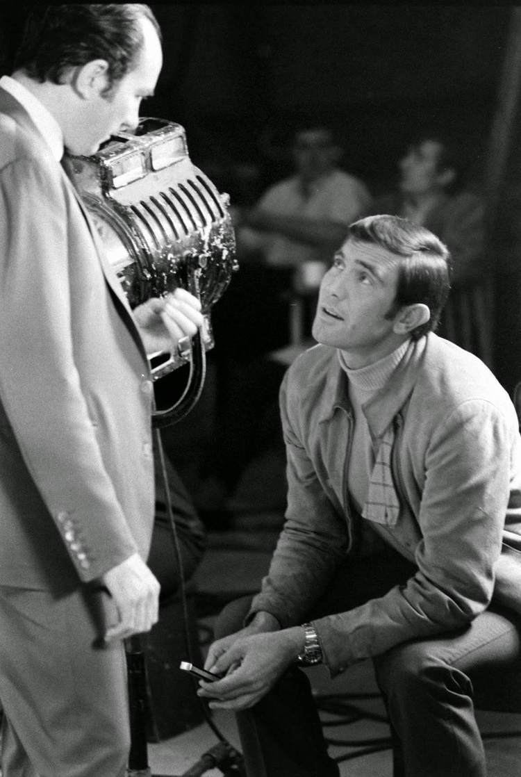 Peter R. Hunt James Bond hopeful George Lazenby fiddles with a knife while