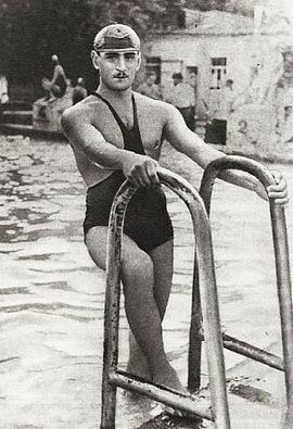 Petre Mshvenieradze is in the pool wearing a swimsuit and a swimming cap