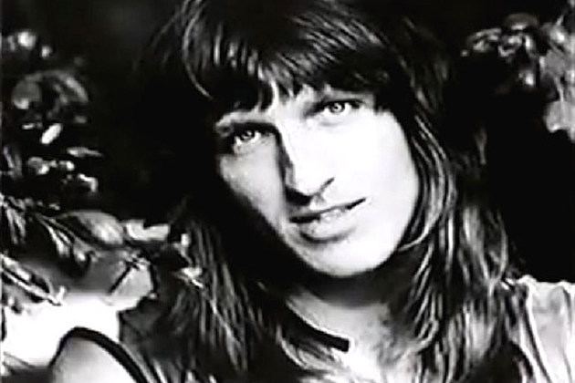 Philip Taylor Kramer smiling with a long hair and bangs
