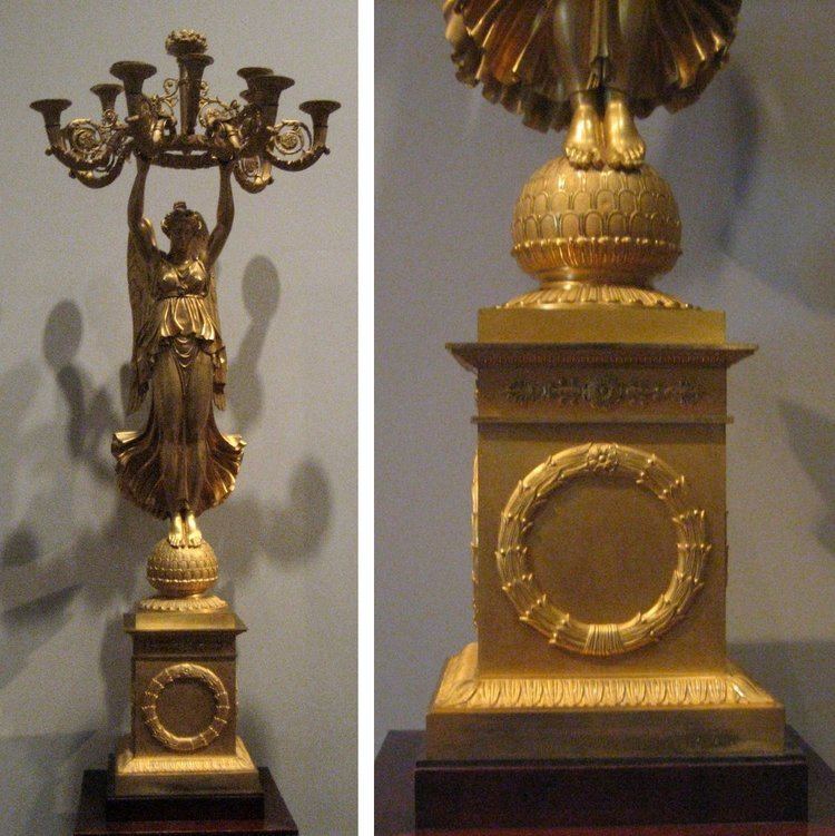Pierre-Philippe Thomire FileOne of a pair of gilt bronze candelabras with winged