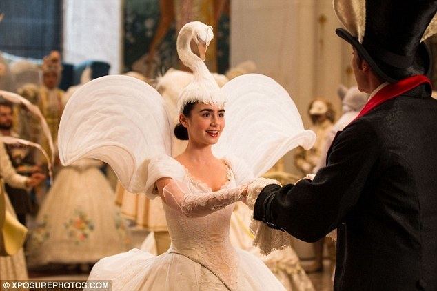 Pin Feathers movie scenes No ugly duckling Lily Collins wears a bizarre swan headdress in one scene from the