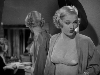 Gertrude Michael wearing a blazer and brassiere in a scene from the 1934 American Pre-Code musical film, Murder at the Vanities
