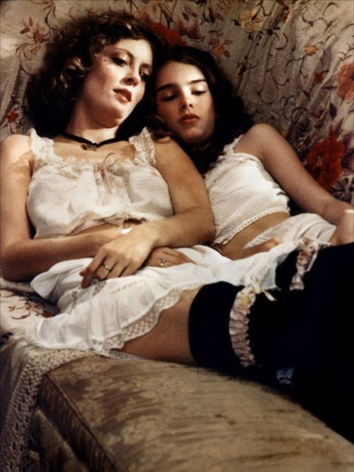 Pretty Baby (1978 film) Brooke Shields and Susan Sarandon both laying down on a couch wearing sleeveless nightwear | movie scenes