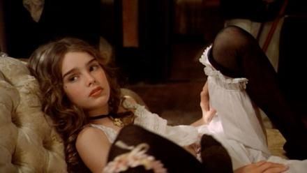 12 year old Brooke Shields in Pretty Baby laying down on a sofa | movie scene