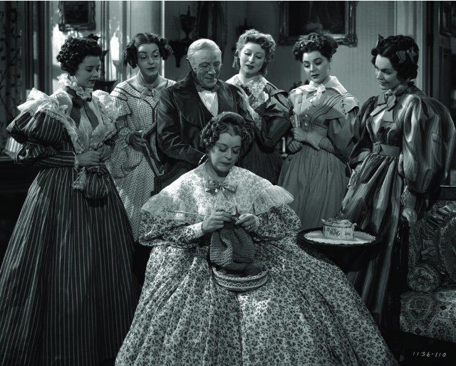 Pride and Prejudice (1940 film) movie scenes The Bennett Family Heath Angel Marsha Hunt Edmund Gwenn Greer Garson Ann Rutherford Maureen O Sullivan and sitting is Mary Boland