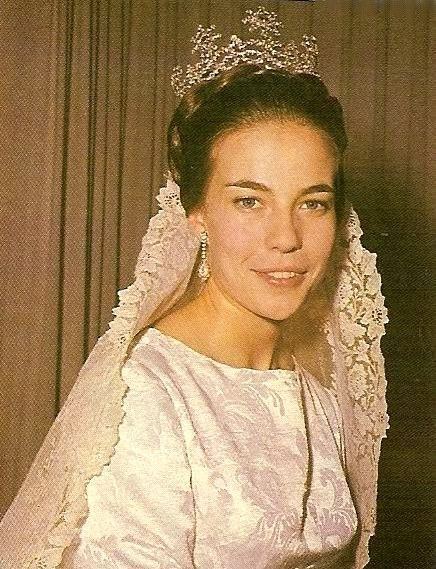 Princess Claude of Orléans wearing wedding gown and crown while smiling