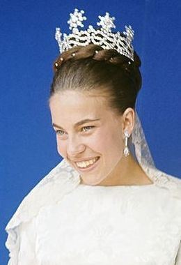 Princess Claude of Orleans's gorgeous smile while wearing white gown and crown