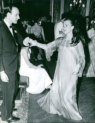 Princess Maria Beatrice of Savoy while dancing with a man