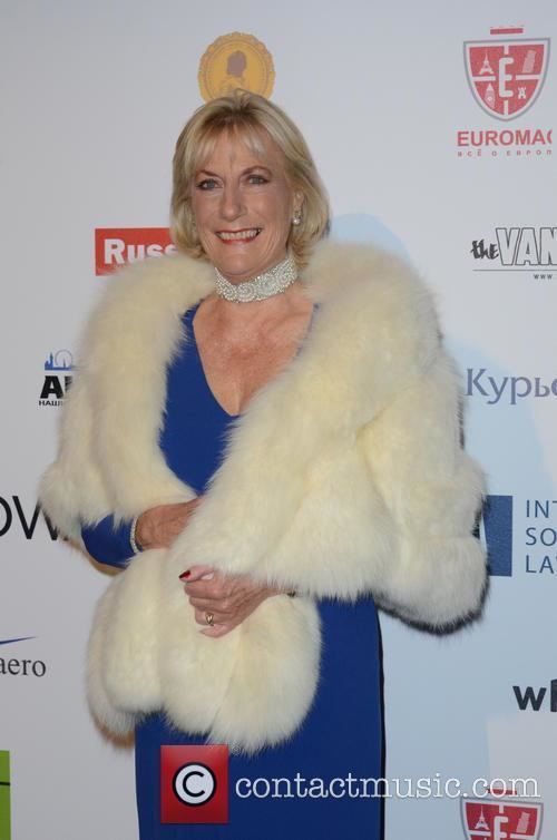 Smiling Princess Olga Andreevna Romanoff wearing a white and blue dress