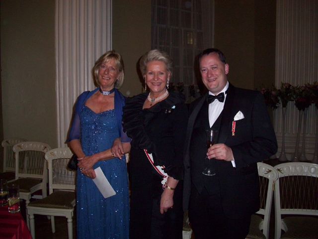 Princess Olga Andreevna, Princess Dimitri Romanov, and Steve Nimmons standing together while wearing formal attire