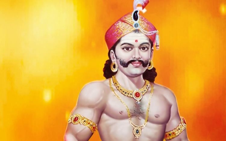 An illustration of Puli Thevar smiling with mustache and topless while wearing gold jewelry on his arms, neck, ears, and an embroidered hat