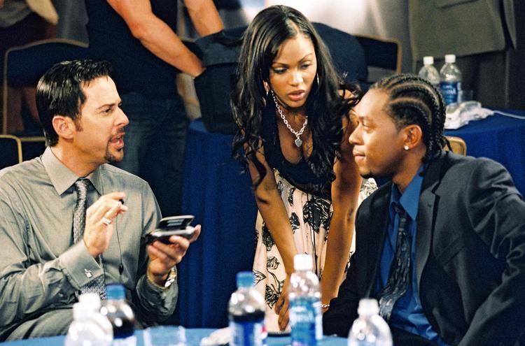 Jonathan Silverman, Meagan Good, and Quran Pender talking to each other in a movie scene from the 2004 film, The Cookout