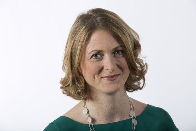 Rachel Burden in white background wearing a green sleeve