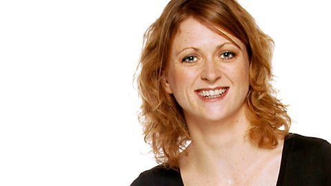 Smiling Rachel Burden wearing black shirt in white background