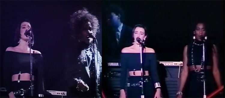 Rachel Fury singing with Durga McBroom while wearing a black blouse