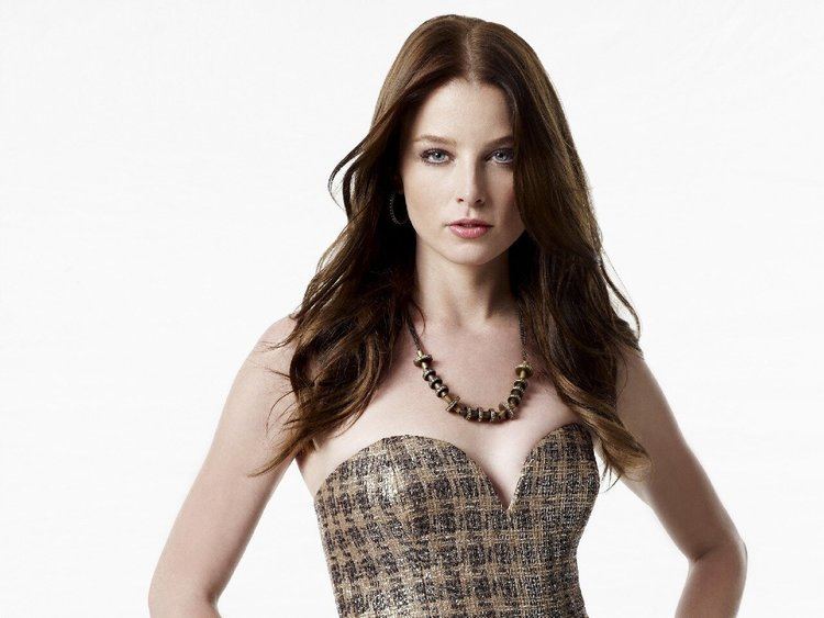 Rachel Nichols wearing a black and brown top and necklace