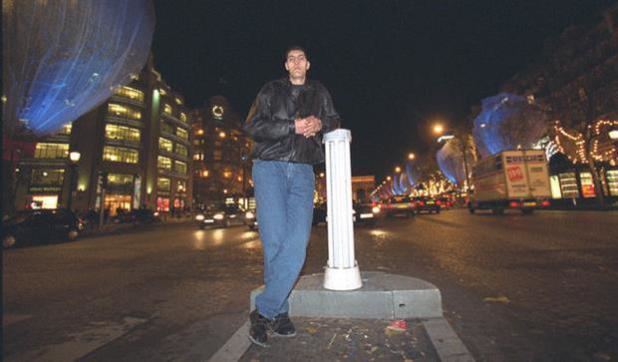 Radhouane Charbib while standing beside a small pole in the city