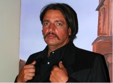 Rafael Rojas in fierce look wearing a black long sleeve while standing