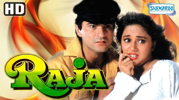 Poster of "Raja", starring Madhuri Dixit as Madhu Garewal wearing white long sleeves and Sanjay Kapoor as Raja wearing a black hat and brown jacket.
