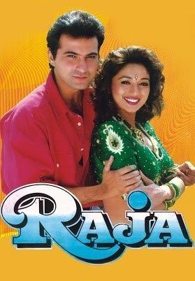 Poster of "Raja", starring Madhuri Dixit as Madhu Garewal wearing a green dress and Sanjay Kapoor as Raja wearing red long sleeves.