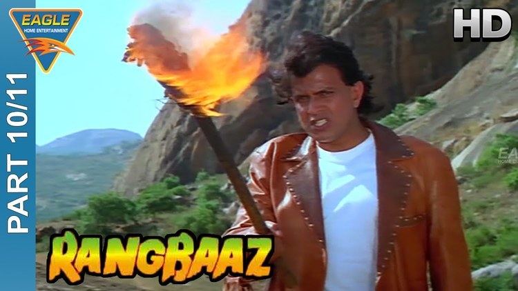 Movie poster of Rangbaaz, a 1996 Indian Hindi-language action film starring Mithun Chakraborty with an angry face while holding a torch of fire, and wearing a brown jacket over white shirt.