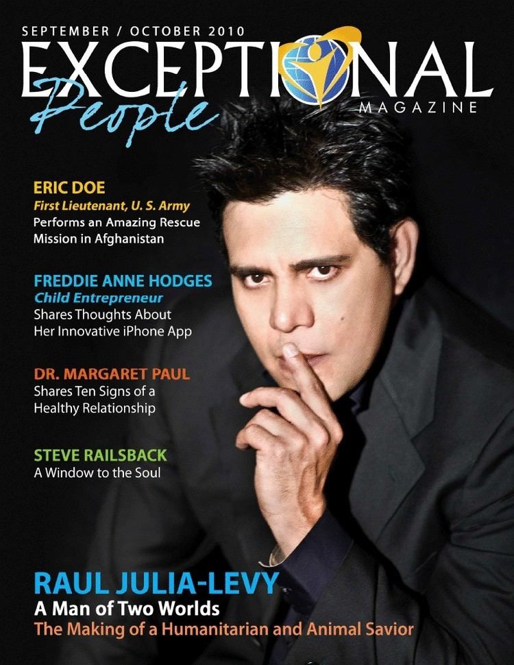 Raul Julia-Levy on the cover page of Exceptional People Magazine with a finger on his lips and he is wearing a black coat