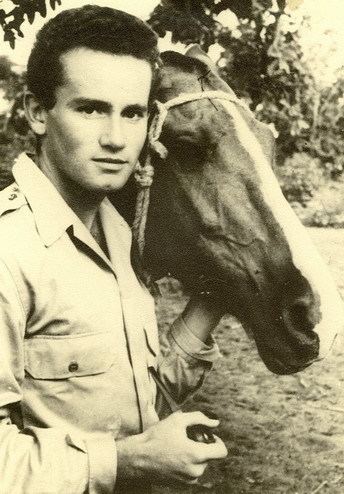 Raymond Maufrais with a horse beside him