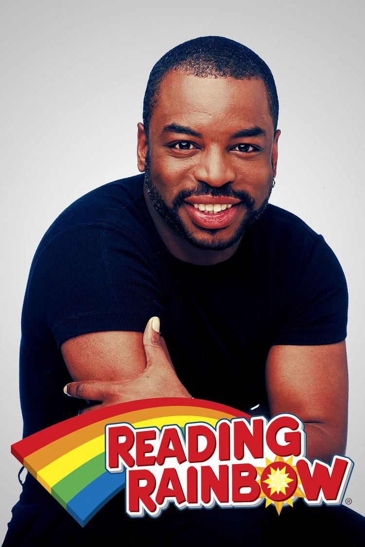 Poster of Reading Rainbow, a 1983 American educational children's television series featuring the host LeVar Burton smiling, with a beard and mustache, wearing an earring, a black shirt, and black pants.