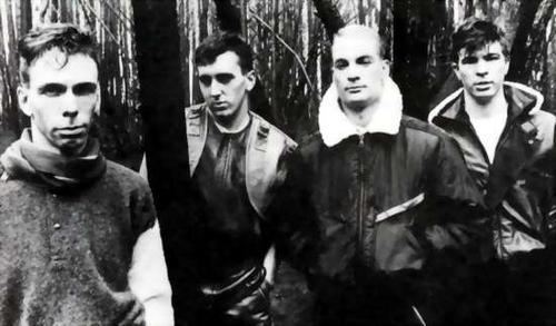 David Sterry, Richard Zatorski, Danny Simcic, and Alan Johnson with serious faces and wearing jackets.